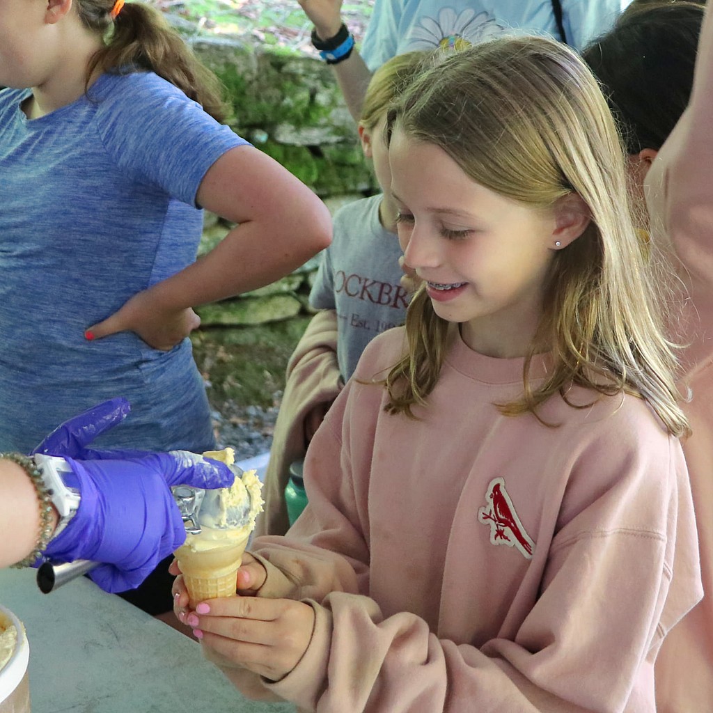 child getting ice cream cone