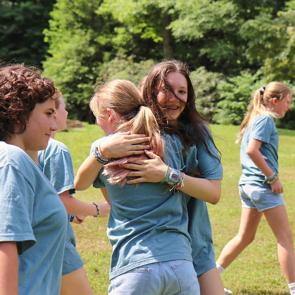 summer camp friends hug