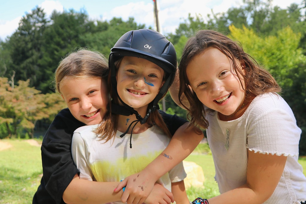 summer camp friends hug