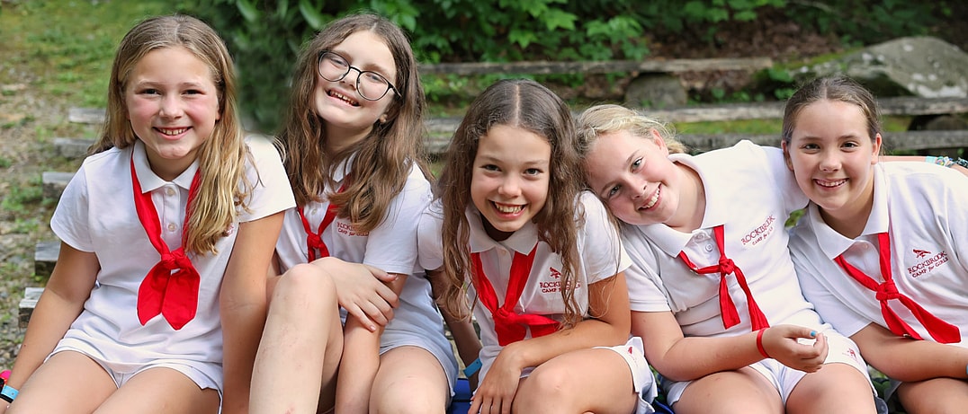 smiling campers in their uniforms