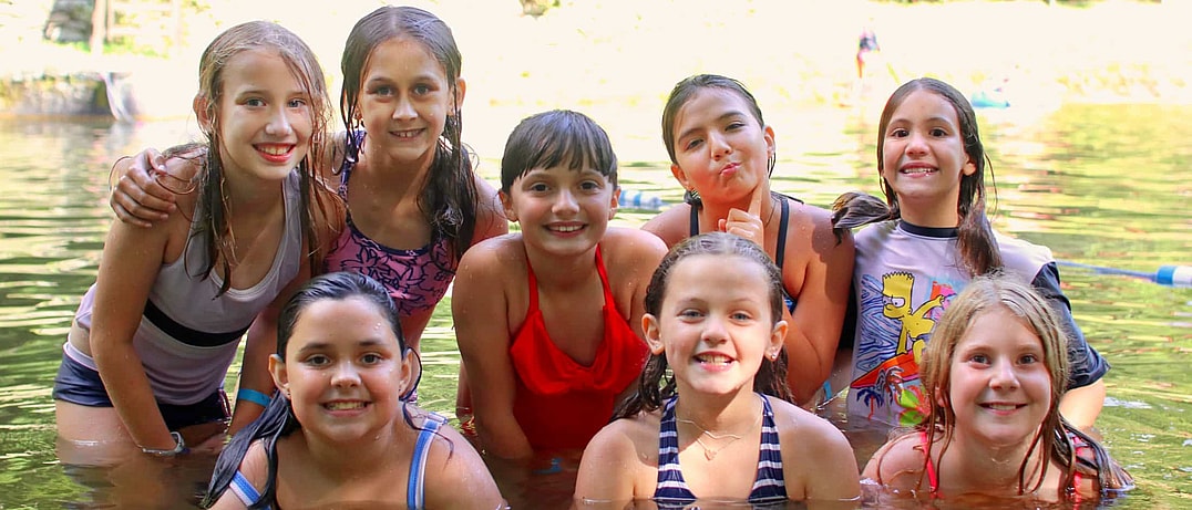 rockbrook camp kids together in lake