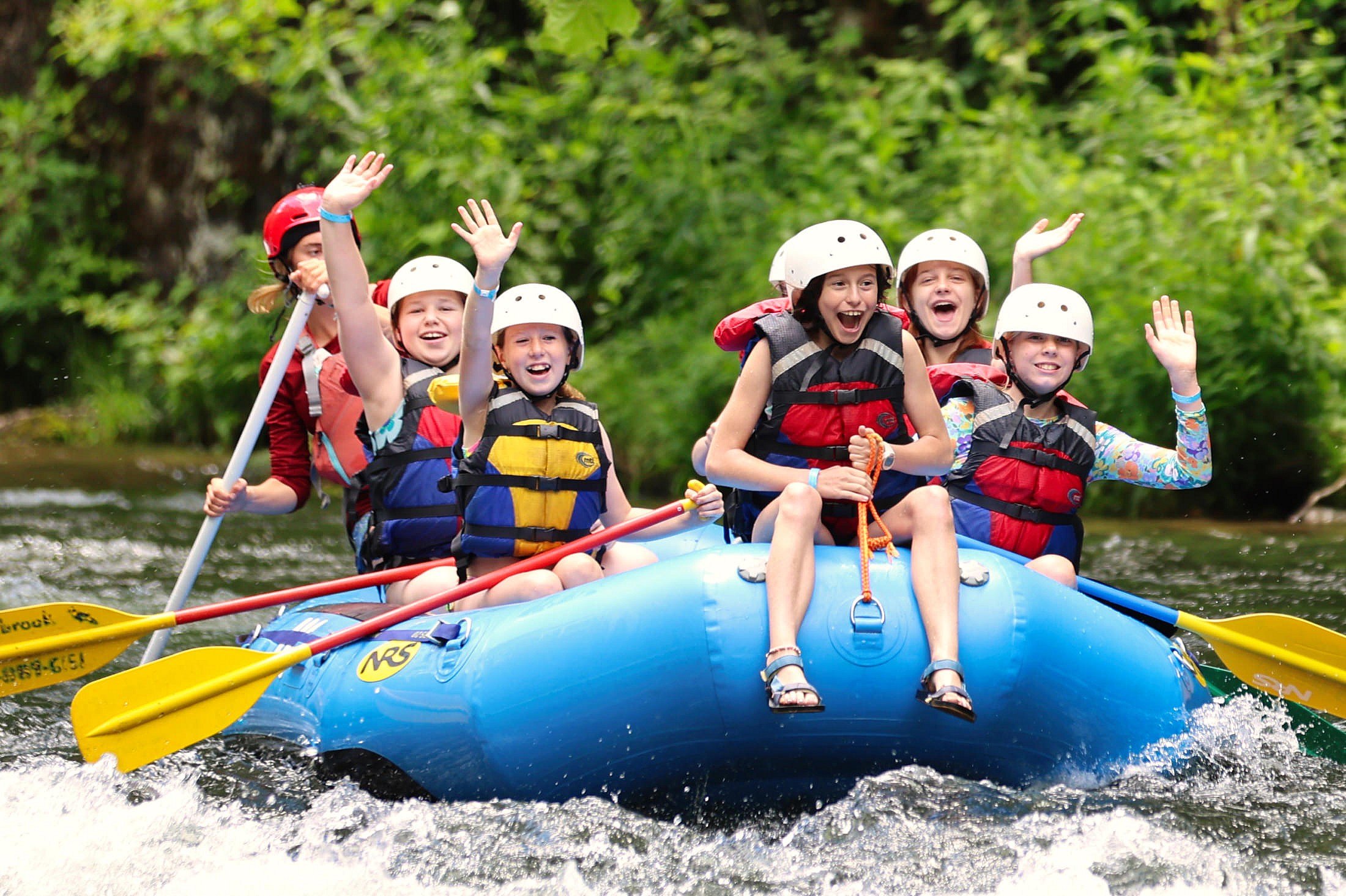 wide-eyed-laughter on rafting trip