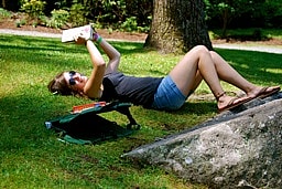 relaxing reading in the grass