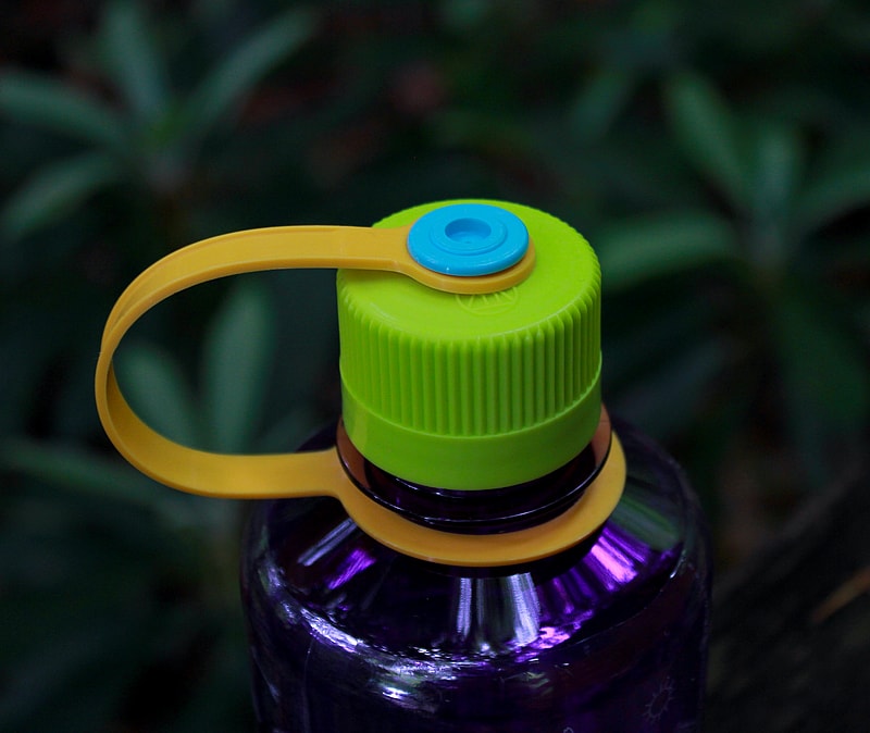 green top small purple water bottle