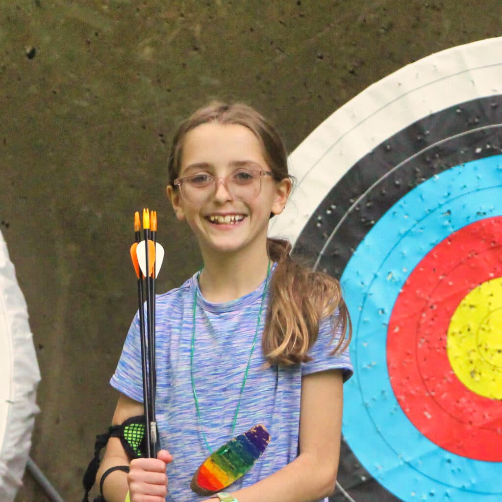 summer camp girl archery holding arrows