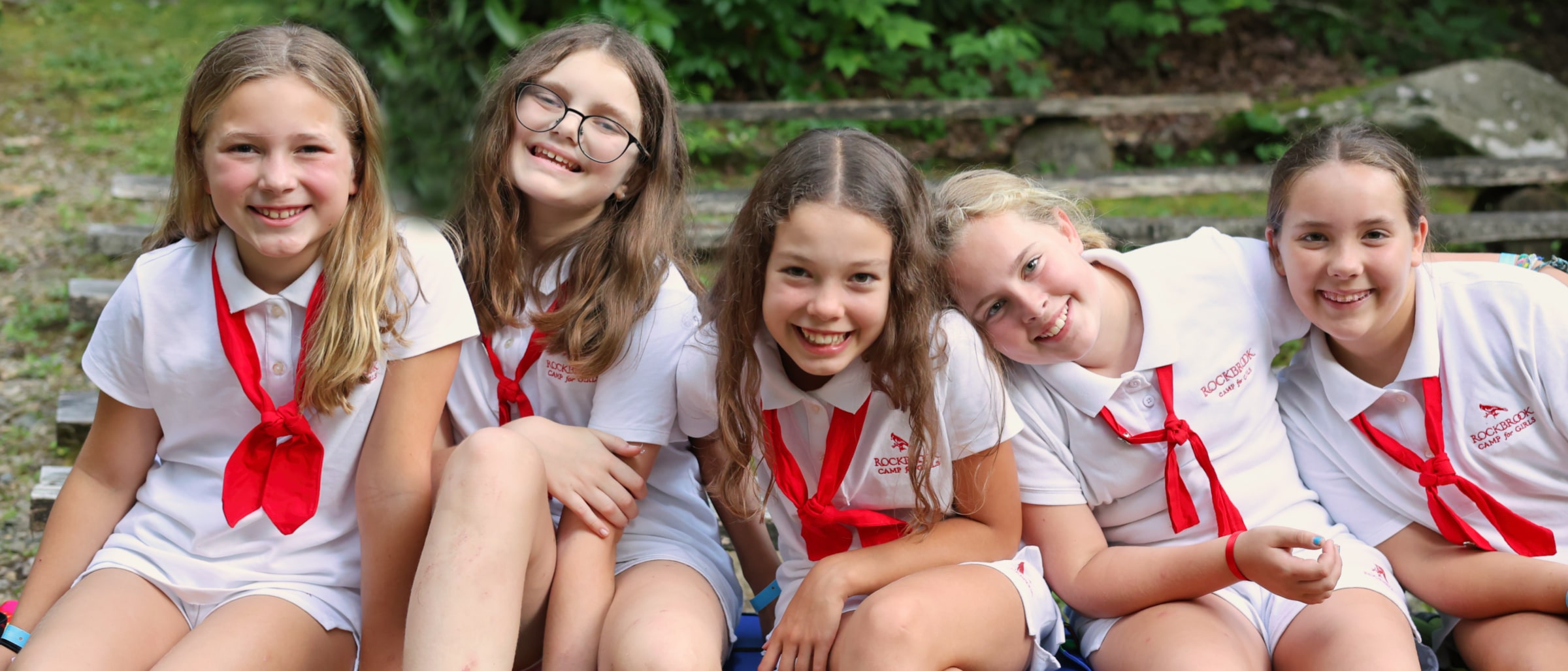 smiling campers in their uniforms