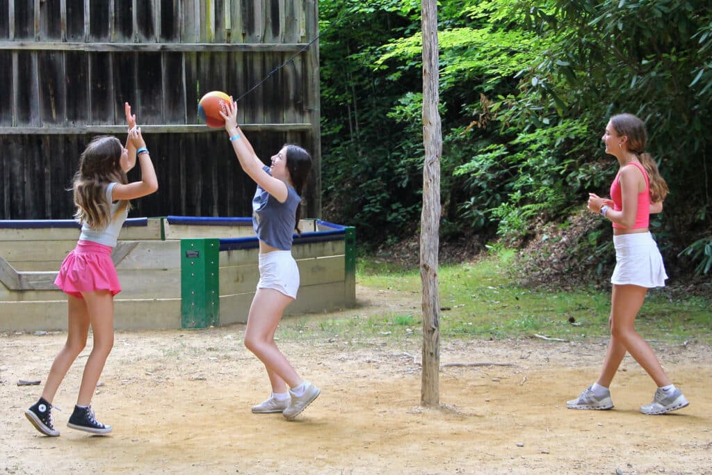 summer camp girls playing tetherball