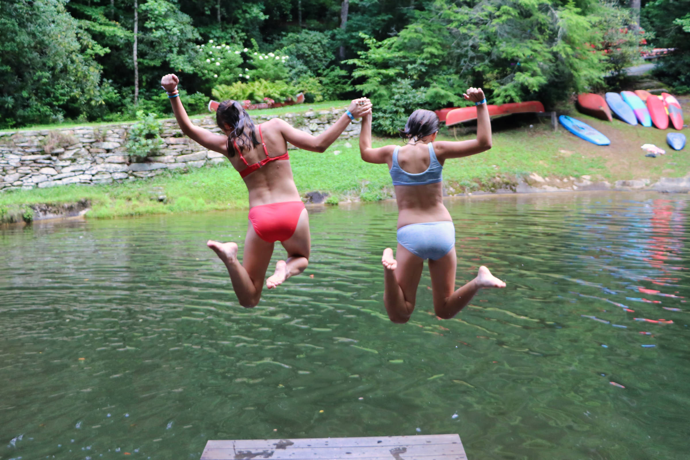 Summer camp lake duo jump.