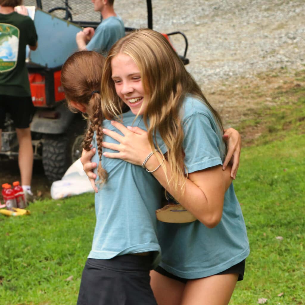 summer camp friends hug