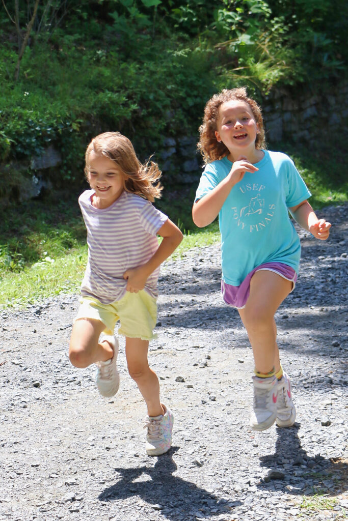 two young camp girls running