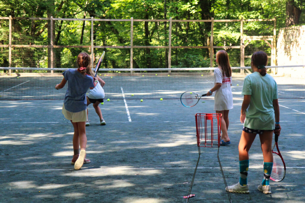 shady summer camp tennis court