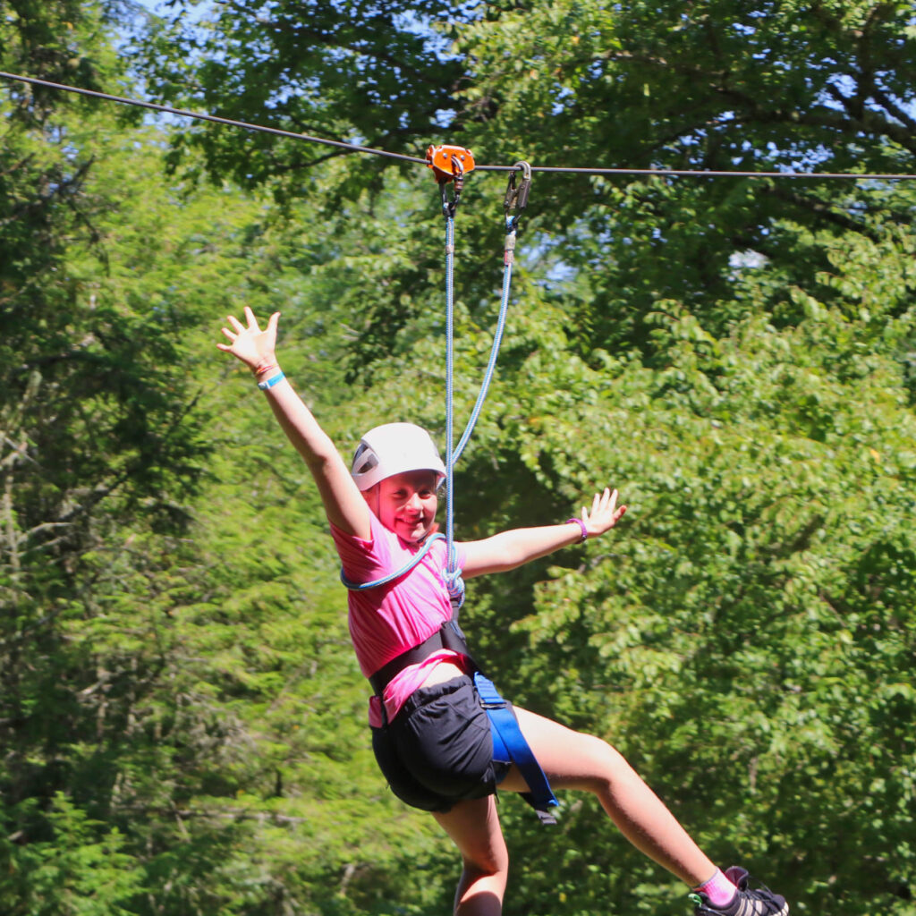 summer camp kid zipping